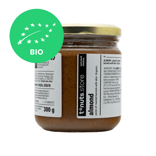 300g glass jar of almond paste with a visible label and organic certification logo on a black background