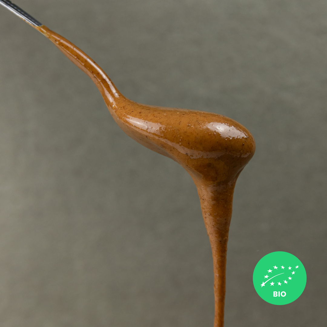 ALMOND • with skin. creamy paste of roasted kernels. no additives. organic.