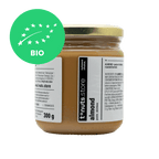 300g glass jar of almond spread with a label on a black background - BIO