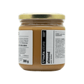 300g glass jar of almond paste with a label on a black background