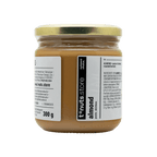 300g glass jar of almond paste with a label on a black background