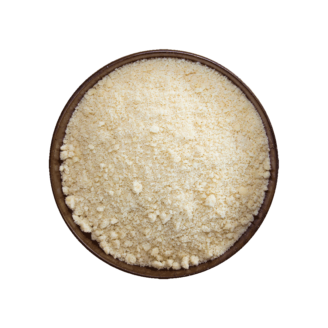 Wooden bowl filled with almond flower on a black background