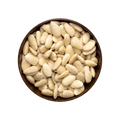 Bowl of raw skinless almonds on a black background