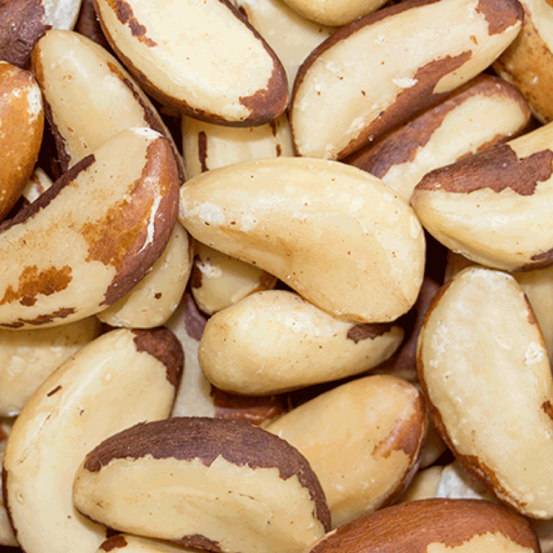 Close-up of Brazil nuts with a focus on their texture and color.