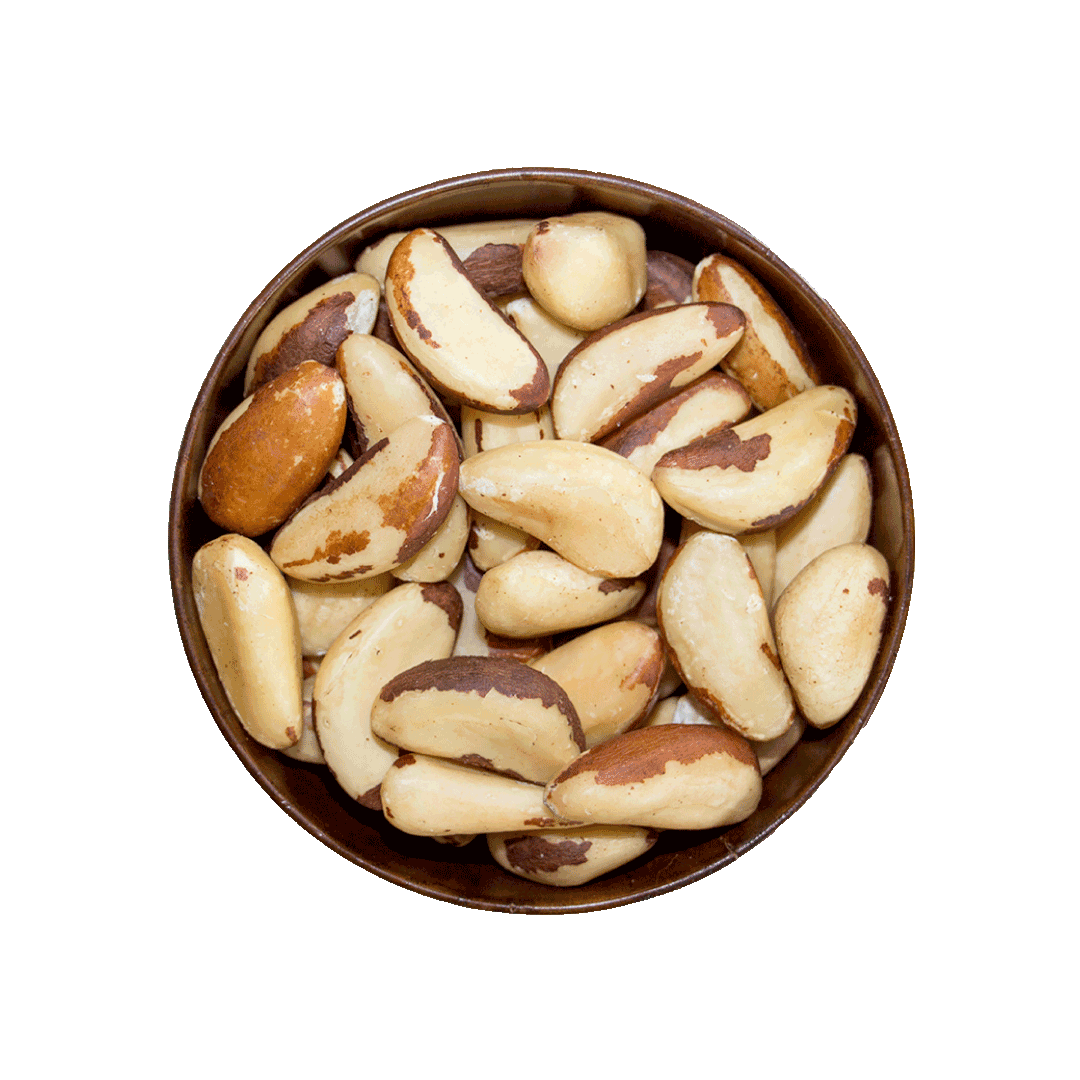 Bowl of Brazil nuts on a black background
