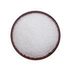 Brown bowl filled with grated coconuts on a black background