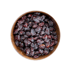 Wooden bowl filled with dried cranberries on a black background