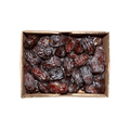 Box of dried dates on a black background