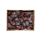 Box of dried dates on a black background