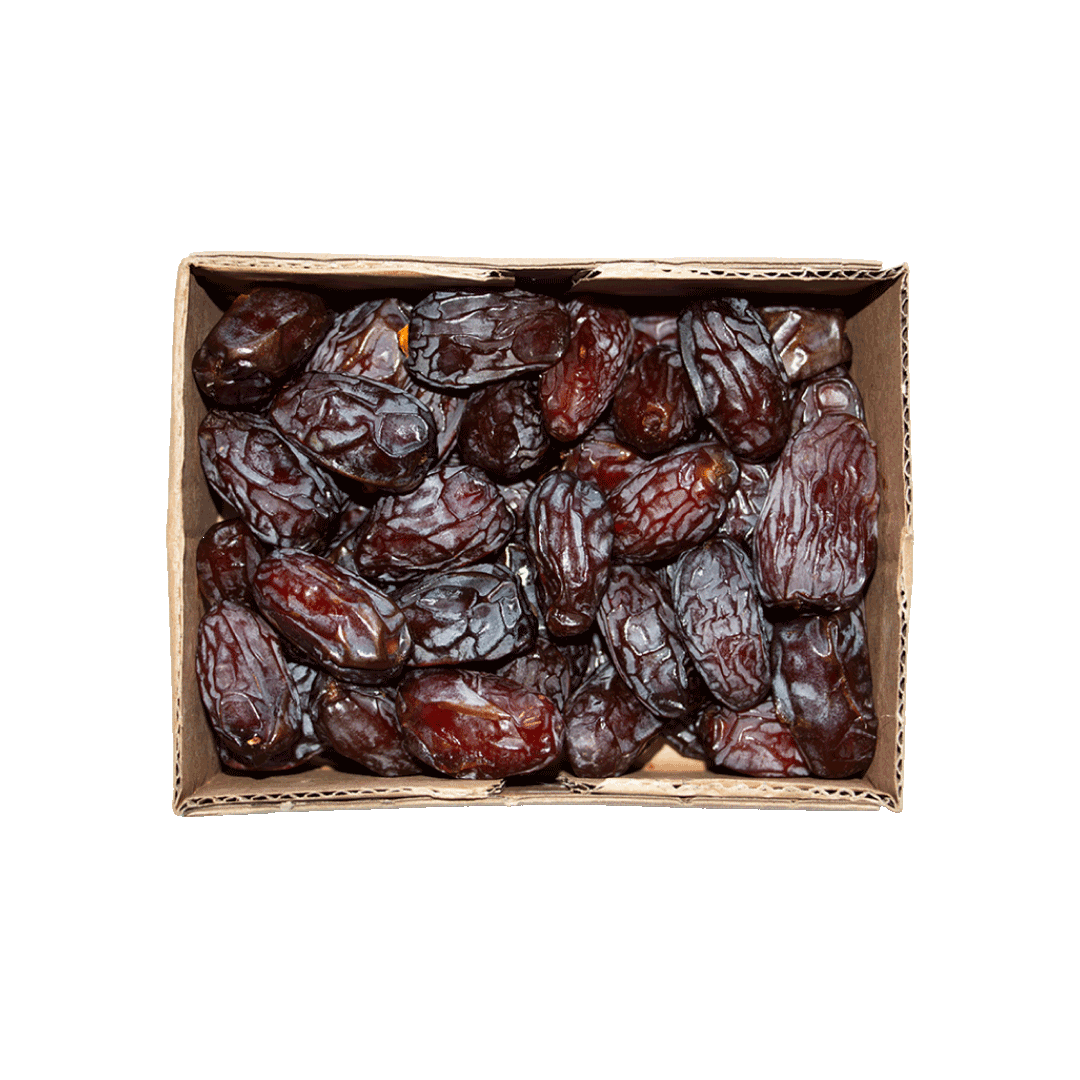Box of dried dates on a black background