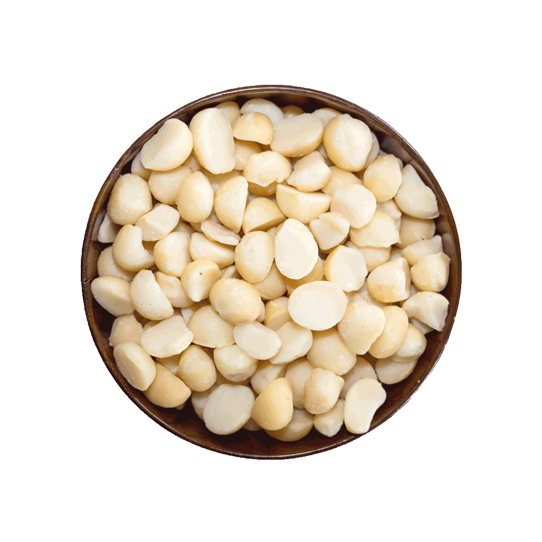 Brown bowl filled with white macadamias on a black background