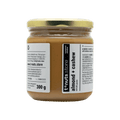 300g glass jar of almond and cashew butter with a visible label on a black background