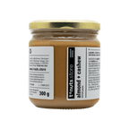 300g glass jar of almond and cashew butter with a visible label on a black background
