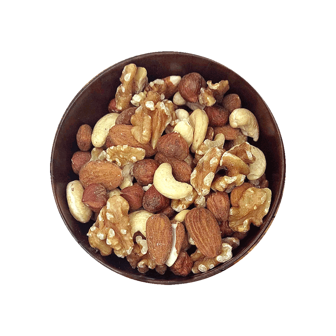 Assorted nuts in a bowl on a black background