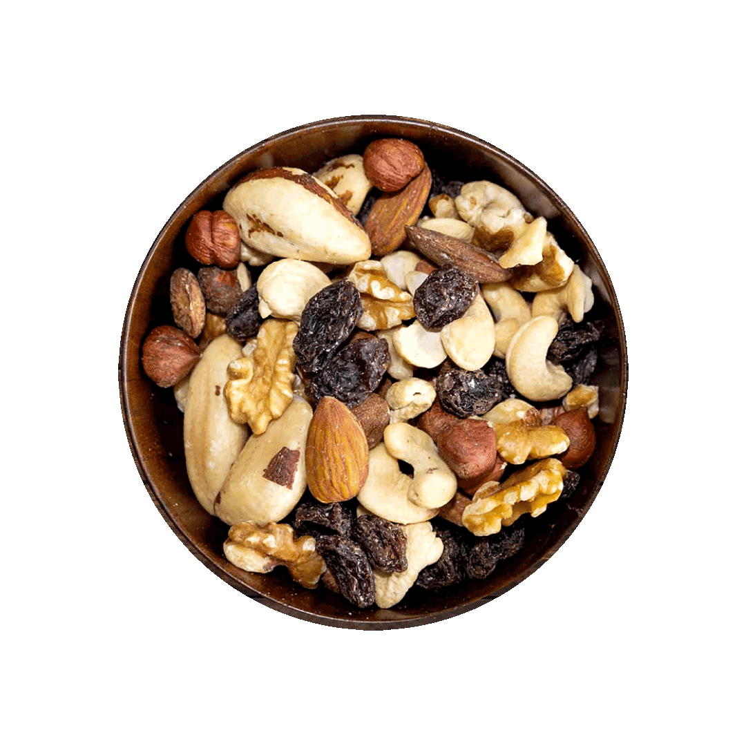 Assorted nuts and dried fruits in a wooden bowl on a black background