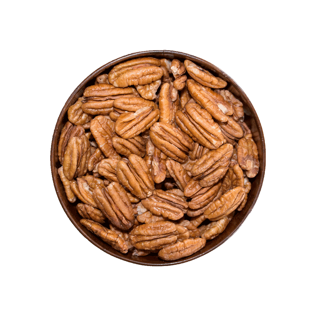 Pecans in a wooden bowl on a black background