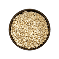 Pine nuts in a metal bowl on a black background
